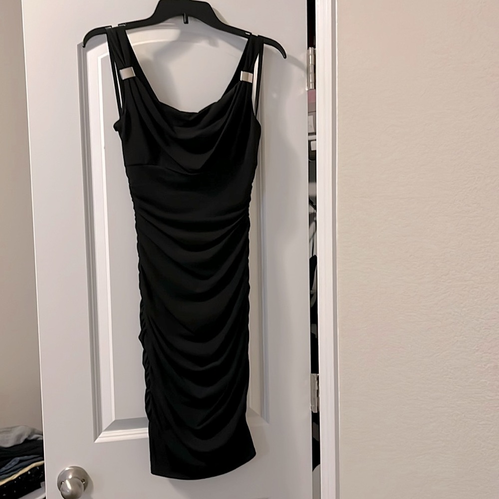 Slimming little black dress from White House Black Market. Never worn. Size 0.